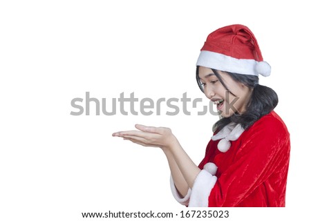 Happy Holidays and New Year Celebration concept ,
Teenage Girl with beautiful long curly hair in wearing a santa claus and Santa hat on white background