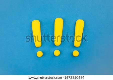 Three vivid spaced exclamation marks model on blue background, flat lay. Warning sign, keep attention concept. 
Interjection sign. Royalty-Free Stock Photo #1672350634