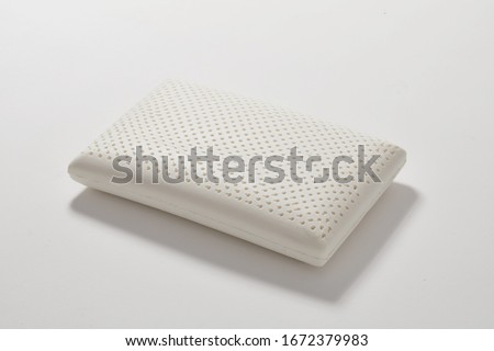 One white latex pillow closeup Royalty-Free Stock Photo #1672379983