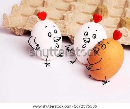 Easter eggs. Three funny white eggs with painted faces. Girlfriends - hen chatter, gossip. Eggs with funny faces. Rest with friends.  communication and relaxation together.