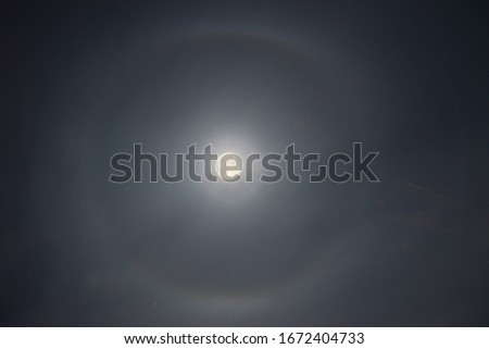 The beauty of nature in the form of the moon in a full halo effect