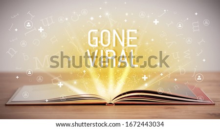 Open book with GONE VIRAL inscription, social media concept