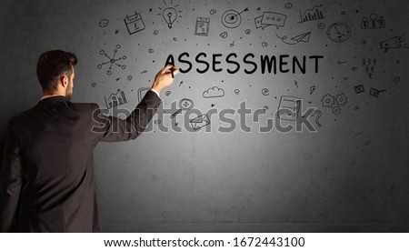 businessman drawing a creative idea sketch with ASSESSMENT inscription, business strategy concept