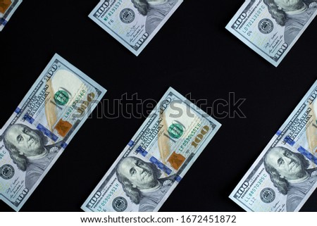 diagonal pattern of hundred dollars on black background