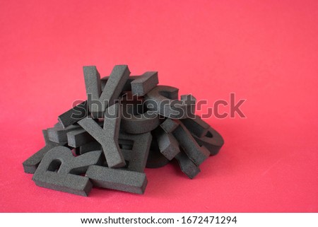 A pile of letters on a red background