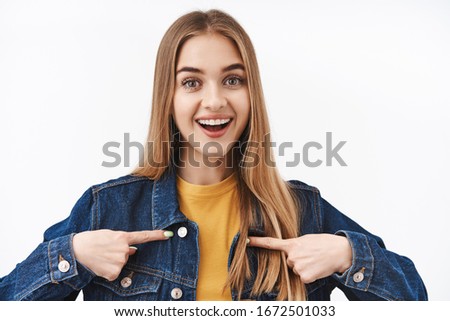 Close-up portrait excted and happy cute young woman with blond hair asking to become member, want participate, pointing herself at chest and smiling, best candidate for job, white background Royalty-Free Stock Photo #1672501033