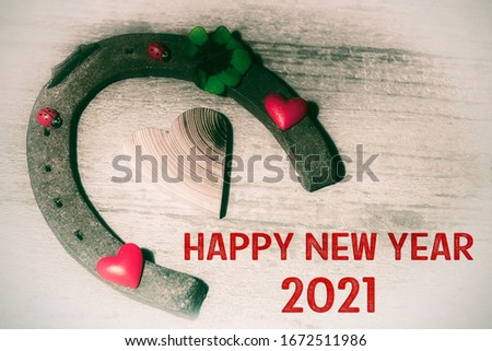 Decoration with horseshoe and text HAPPY NEW YEAR 2020