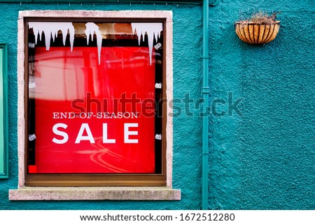 Closing down sale sign with further reductions and discount in shop store mall window