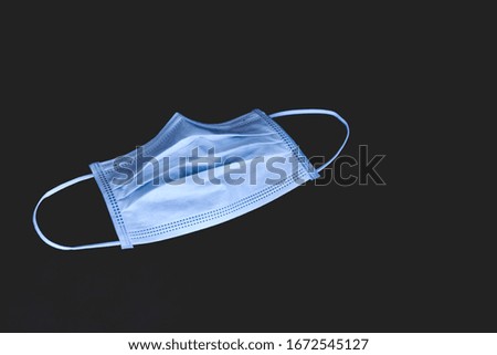 surgical mask or Medical face mask for protection corona virus (covid-19) with road background.surgical mask with covid-19 word.