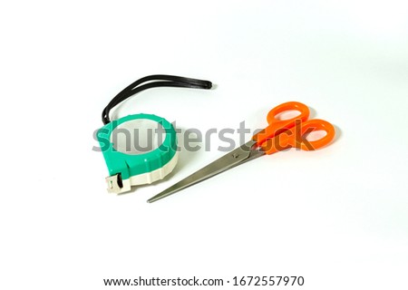 Scissor and measuring stripes without open isolated on white background, stainless steel fold able measurement tape, ribbon made of steel, cutter scissors