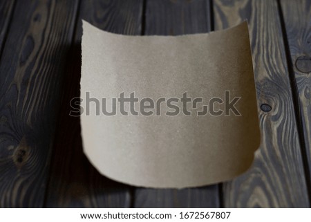sheet of paper on wooden background