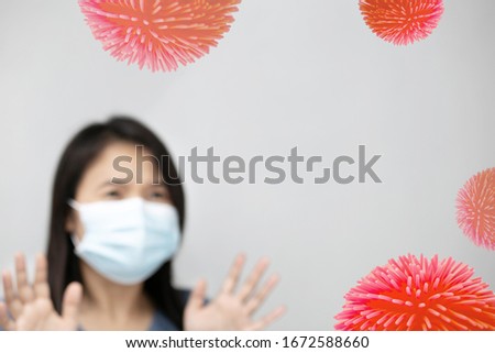 Coronavirus concept on red background, Asian woman wearing facial mask for protection from air pollution or virus epidemic.