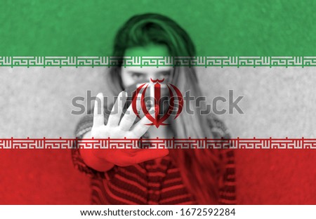 Girl in a mask against the background of the Iran flag. Stop Coronavirus. 