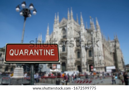 Quarantine sign with Milan Cathedral background. Warning about epidemic quarantine in Italy. Coronavirus disease. COVID-2019 alert sign