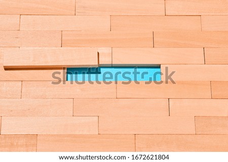 The wooden planks are staggered on a light blue in the center of an empty space for Your text. Abstract background.