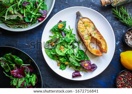 pink salmon steak fried and salad,
grilled seafood, pescatarian Menu concept food background keto or paleo diet. top view. copy space for text Royalty-Free Stock Photo #1672716841