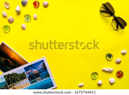 Summer vacation concept. Beach accessories on a yellow background.