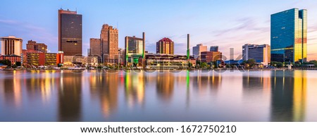 Toledo, Ohio, USA downtown skyline on the Maumee River at dusk. Royalty-Free Stock Photo #1672750210