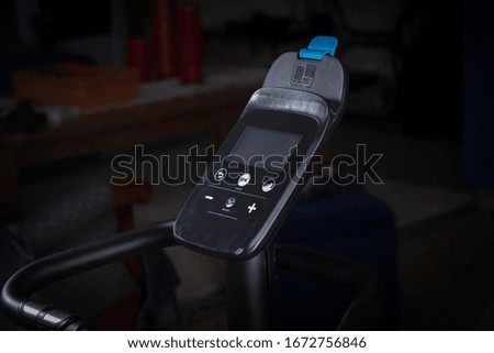 Detail of static bike control panel. on dark background.