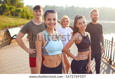 A group of athletes training in the park.