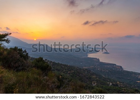 Crete island beach and mountains in sunset time. Greece vacation.