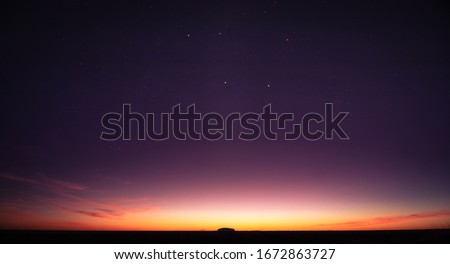 Sunrise and star at Uluru in Northern Territory 