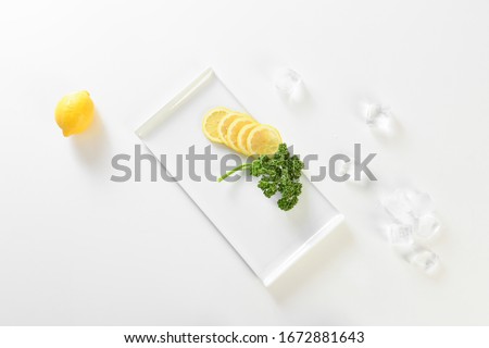  yellow lemon on square plate