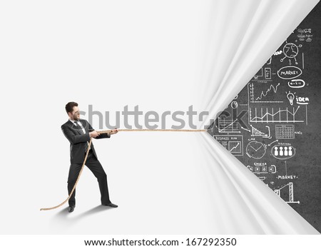 young businessman pulling rope and drawing  business concept