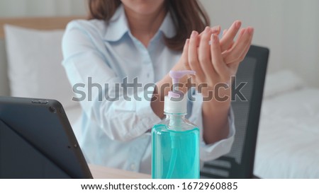 Hand of woman pressing alcohol gel from bottle and applying sanitizer gel for hand wash to make cleaning and clear germ, bacteria and virus. Pandemic protection, Hygienic and Health care concept. Royalty-Free Stock Photo #1672960885