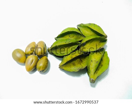 A picture of Carambola fruits with plum on white background