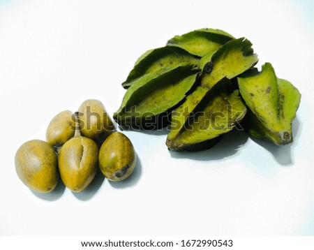 A picture of Carambola fruits with plum on white background