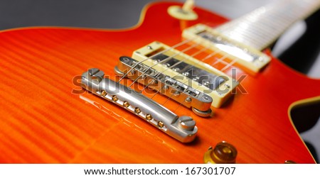 Close-up of red electric guitar