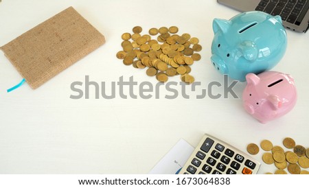 piggy bank and stake coins and calculator in white background. saving money for new car. copy space