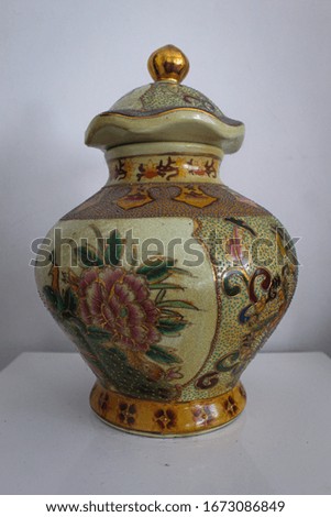 flower-style ceramic on the outside and a charming lid