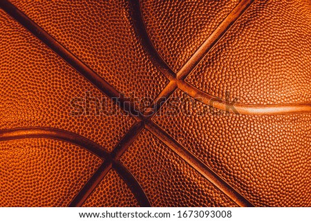 Closeup detail of basketball ball texture background. Gold color Banner Art concept