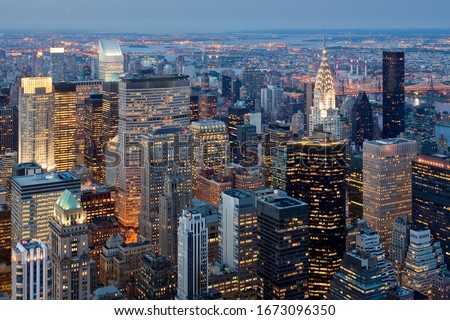Sunset in the skyscrapers of Manhattan Royalty-Free Stock Photo #1673096350