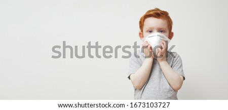 Little boy, kid, baby or children trying to stay healthy by wearing a mask to protect him against corona virus covid -19 and 2019-nCov. Concept: sick of covid, isolated on white, missing family. 


 Royalty-Free Stock Photo #1673103727