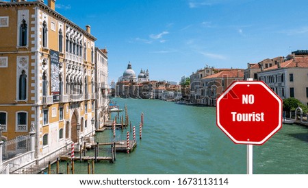 No tourist sign on a stop sign representing tourists in Venice Italy due to the epidemic