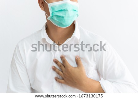 Men wearing white shirts wearing masses have a chest sore from coughing or suffocating.