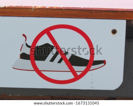 Signs in front of the temple ,No shoes sign on the rope, Thailand,