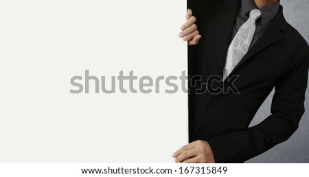 Business man handing a blank business card over 