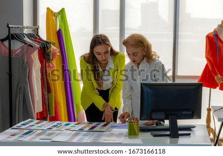 Fashion designers work designing clothes in the office