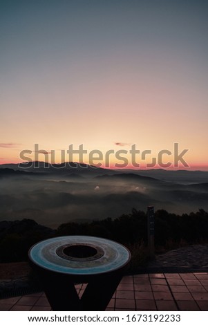 Awesome Sunset viewed from La Mola, which is in Catalonia. In this picture we can see the clouds and the fog over the mountains .