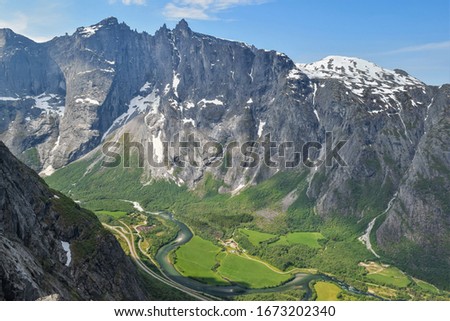 Troll Wall, Norway - June 1,2019. The highest vertical cliff in Europe. Troll wall seen from Romsdalshornet. Royalty-Free Stock Photo #1673202340