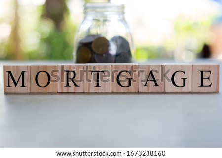 MORTGAGE word on wooden block. Business concept