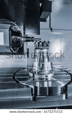 Metalworking CNC lathe milling machine. Cutting metal modern processing technology. Milling is the process of machining using rotary cutters to remove material by advancing a cutter into a workpiece. Royalty-Free Stock Photo #1673275513