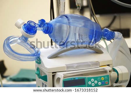 Respiratory mask with resuscitator for ventilation of a patient with pneumonia in the operating room of a hospital                                Royalty-Free Stock Photo #1673318152
