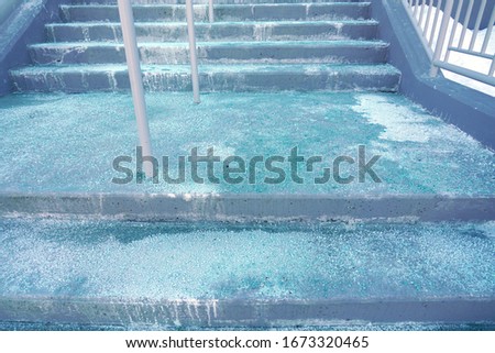 Melting salt on the stair steps in winter season         