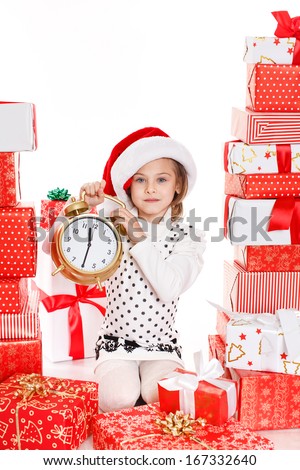 Portrait of Santa hat Christmas girl holding christmas gifts smiling happy and excited. Cute beautiful santa child on white background.