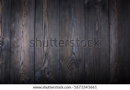 An old dark wooden table. Background Royalty-Free Stock Photo #1673343661